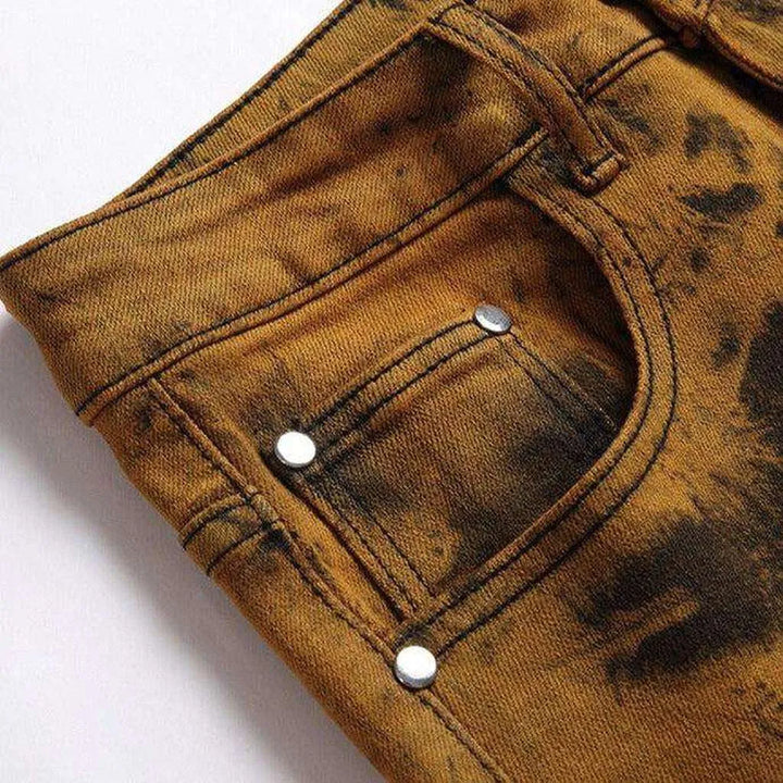 Orange over-dyed men's jeans