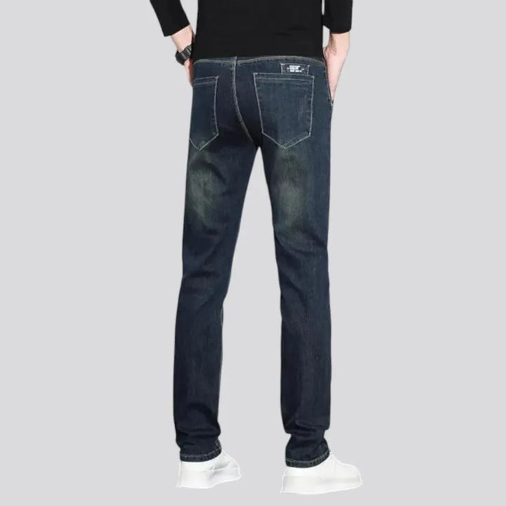 Dark abraded slim fit men's jeans