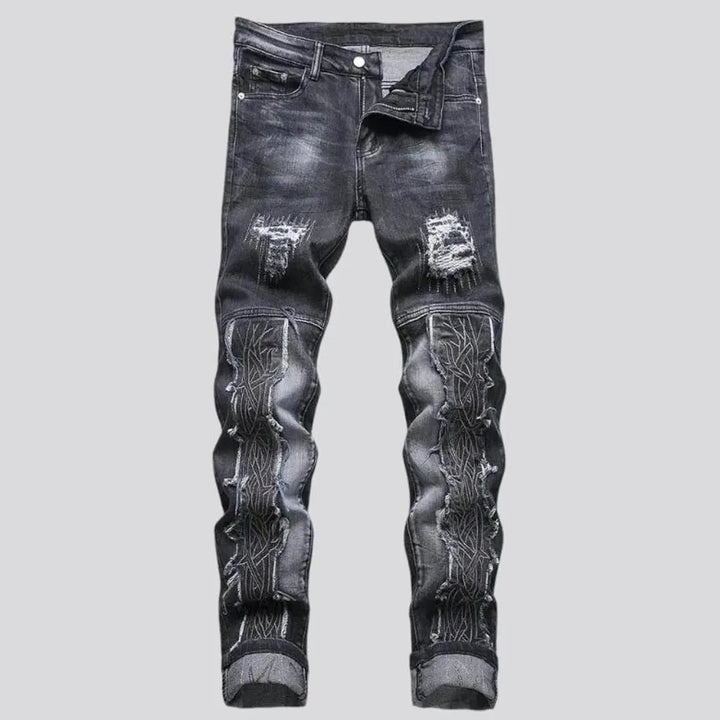 Whiskered embroidered distressed men's jeans