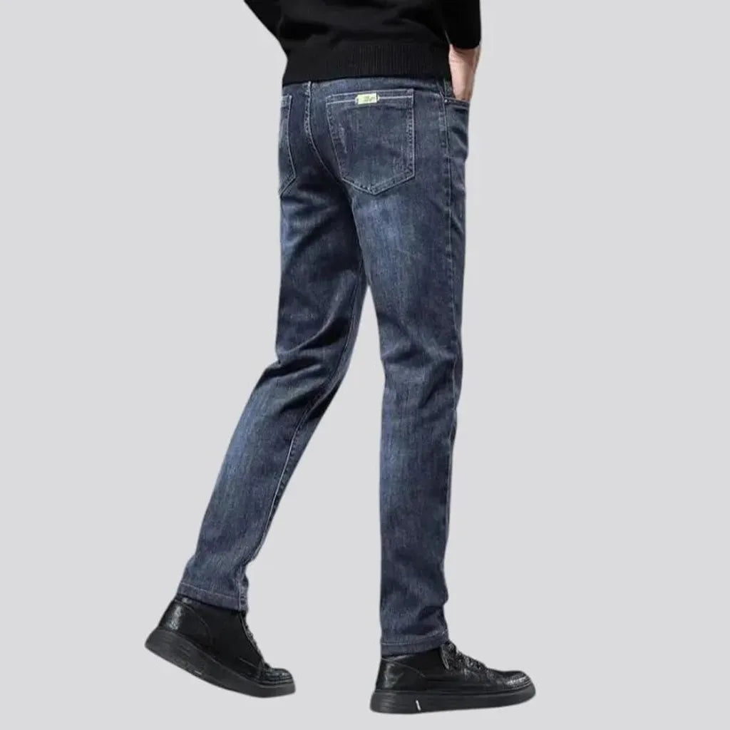 Elastic dark padded jeans for men