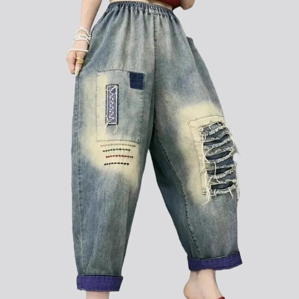 Sanded distressed jeans pants for women