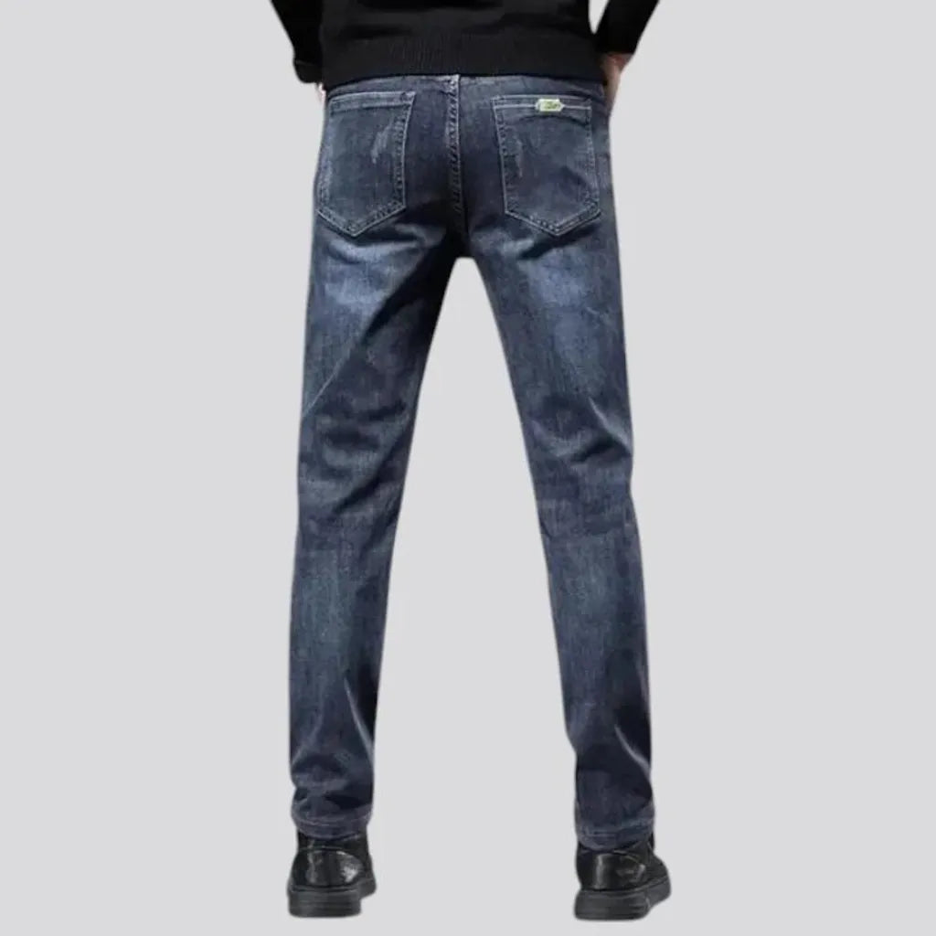 Elastic dark padded jeans for men