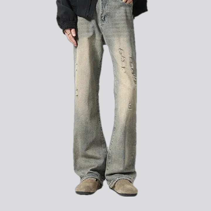 Fashionable bootcut distressed men's jeans