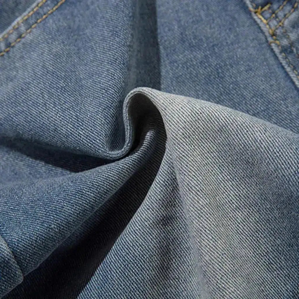 Medium-wash distressed jeans
 for men