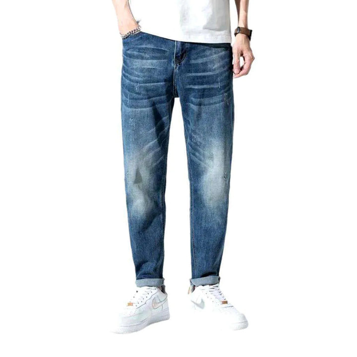 Mid-waist men's medium-wash jeans