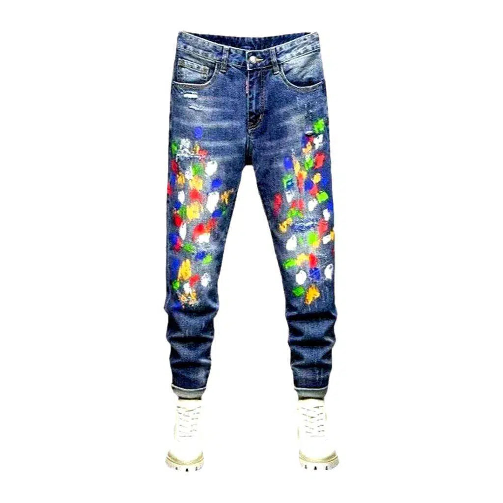 Multi-color stains sanded jeans