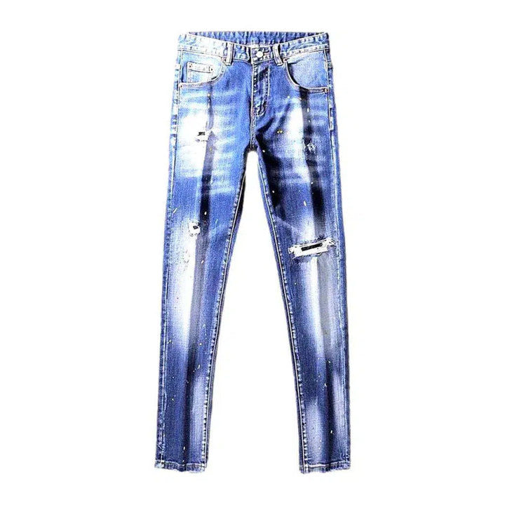 Paint-splattered medium men's wash jeans